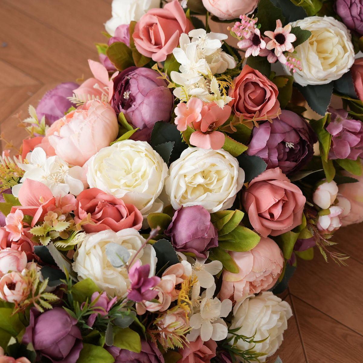 Luxury flower designed for wedding head table, pink mauve and white blooms with green foliage