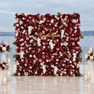 Deep burgundy flower wall set against white panel interior wall