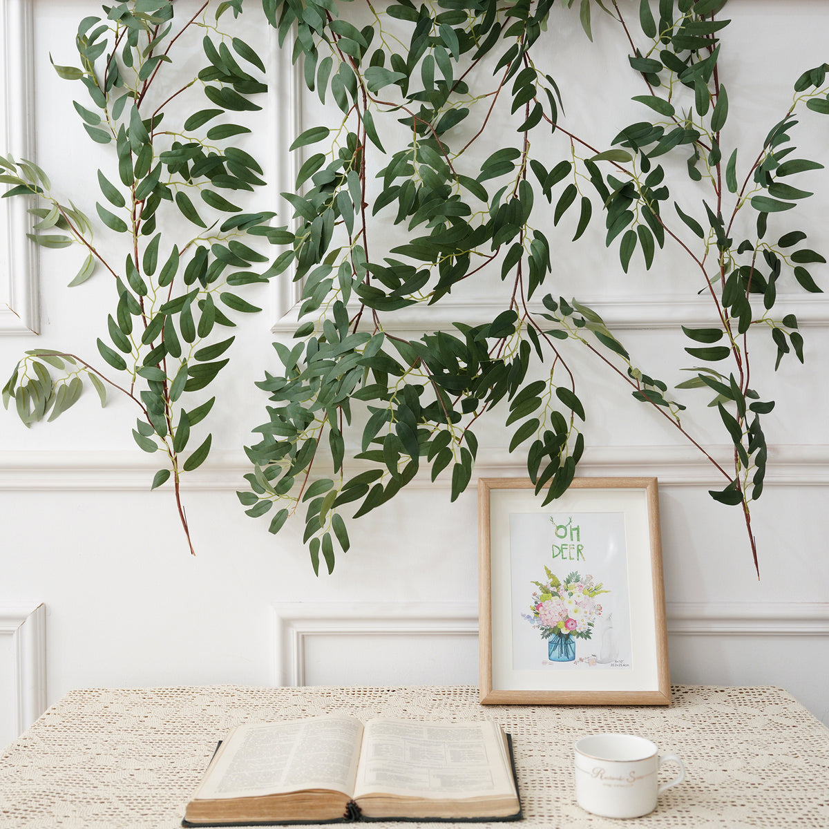 Rust faux eucalyptus leaf vine wedding aisle decoration