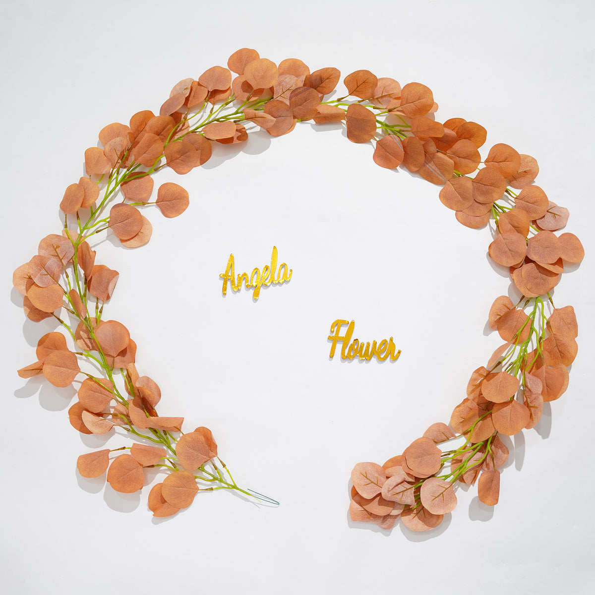 Outdoor wedding faux eucalyptus strand arch greenery decor