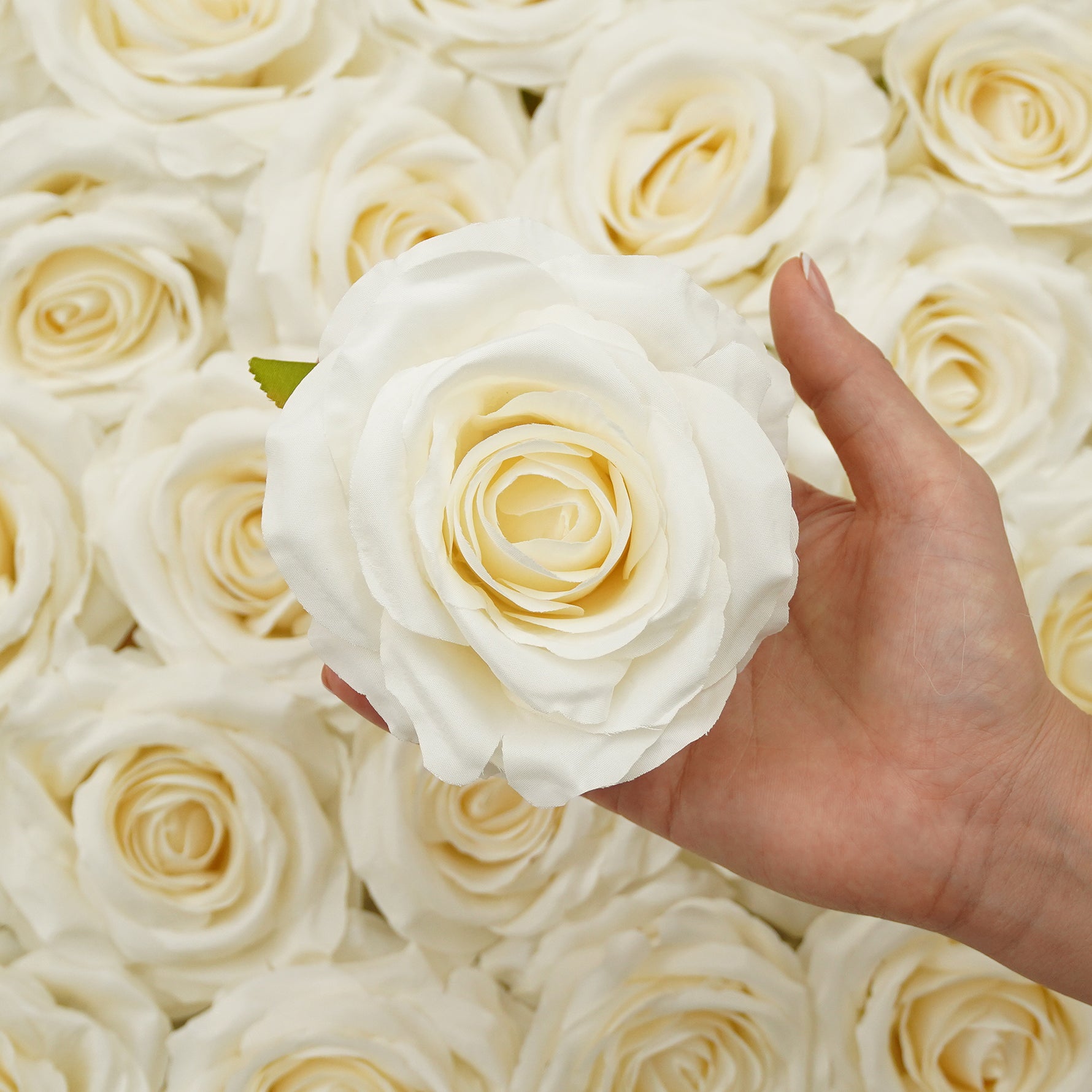 White artificial rose blooms for bridal bouquet decoration