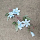 multi‑colored-faux-clematis-bloom-home-styling
