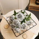 silver-faux-rose-bloom-macro-shot-with-foliage
