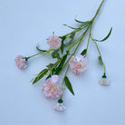 mixed‑tone‑fake‑carnation‑stems‑loose‑bunch‑floral‑arrangement‑shot