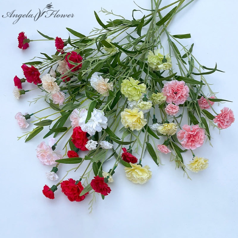 multicolor‑artificial‑carnation‑stems‑flat‑lay‑white‑background