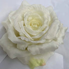 assorted‑color‑fake‑rose‑heads‑studio‑flat‑lay
