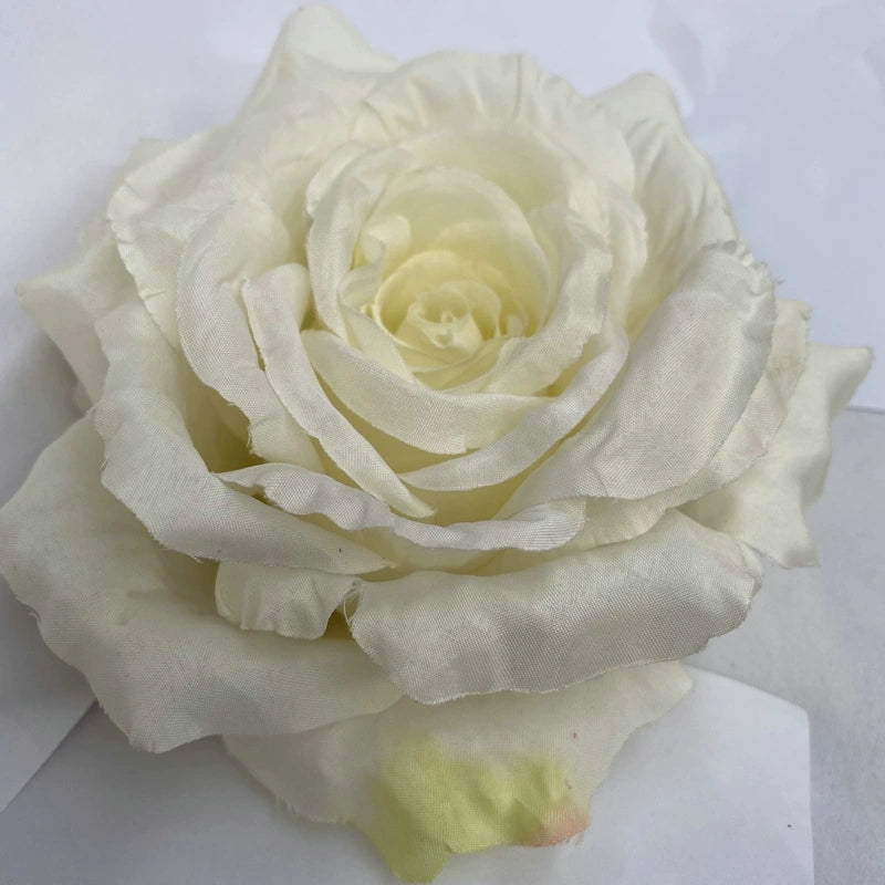 assorted‑color‑fake‑rose‑heads‑studio‑flat‑lay

