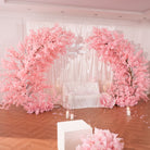 pink cherry blossom full wedding setup with aisle and candles