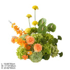 Green and orange mixed blooms table centerpiece for party