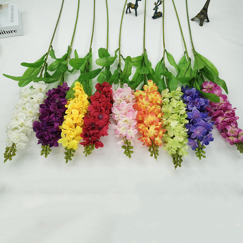 single_sprig_delphinium_with_green_leaves