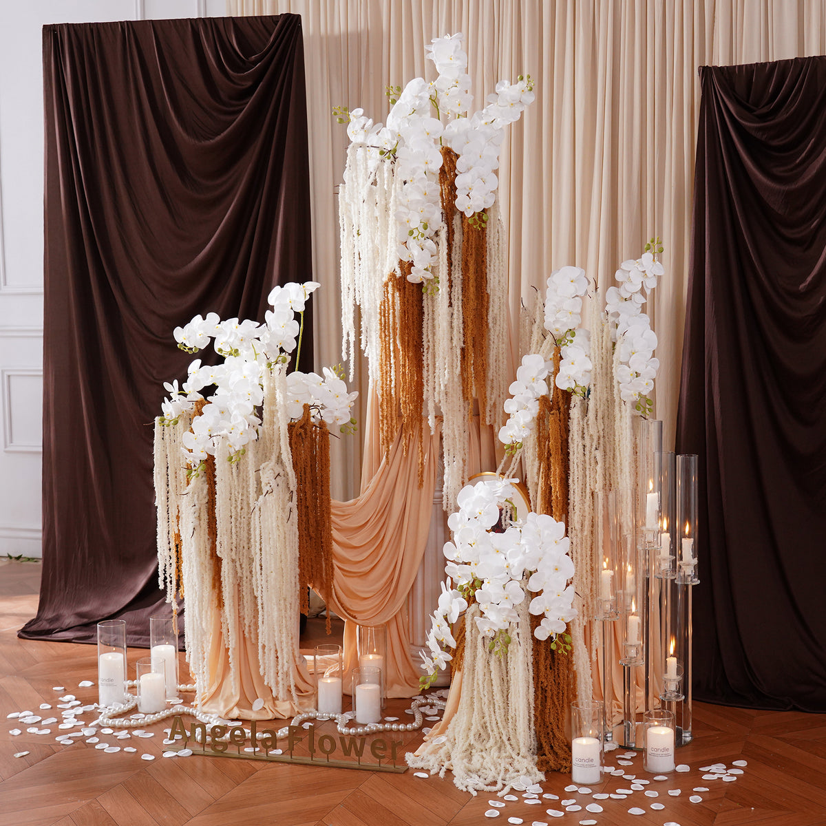 close up of textured faux white orchid and hanging amaranthus floral stems