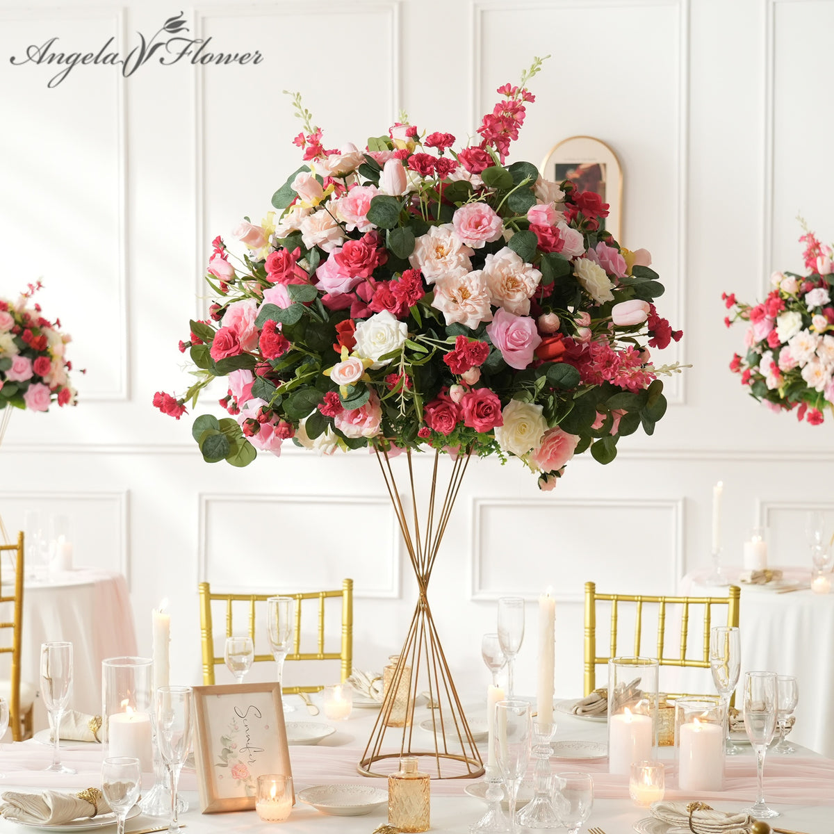 Tall artificial wedding table centerpiece with blush fuchsia red silk roses and greenery for wedding reception decor