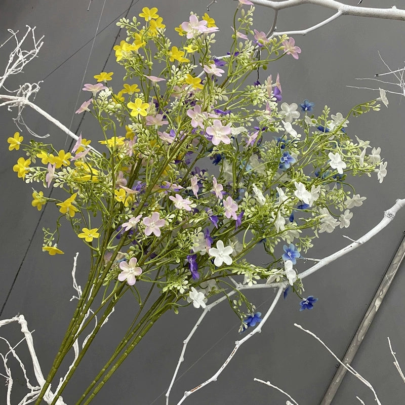 Purple faux daisy spray for wedding backdrop decor
