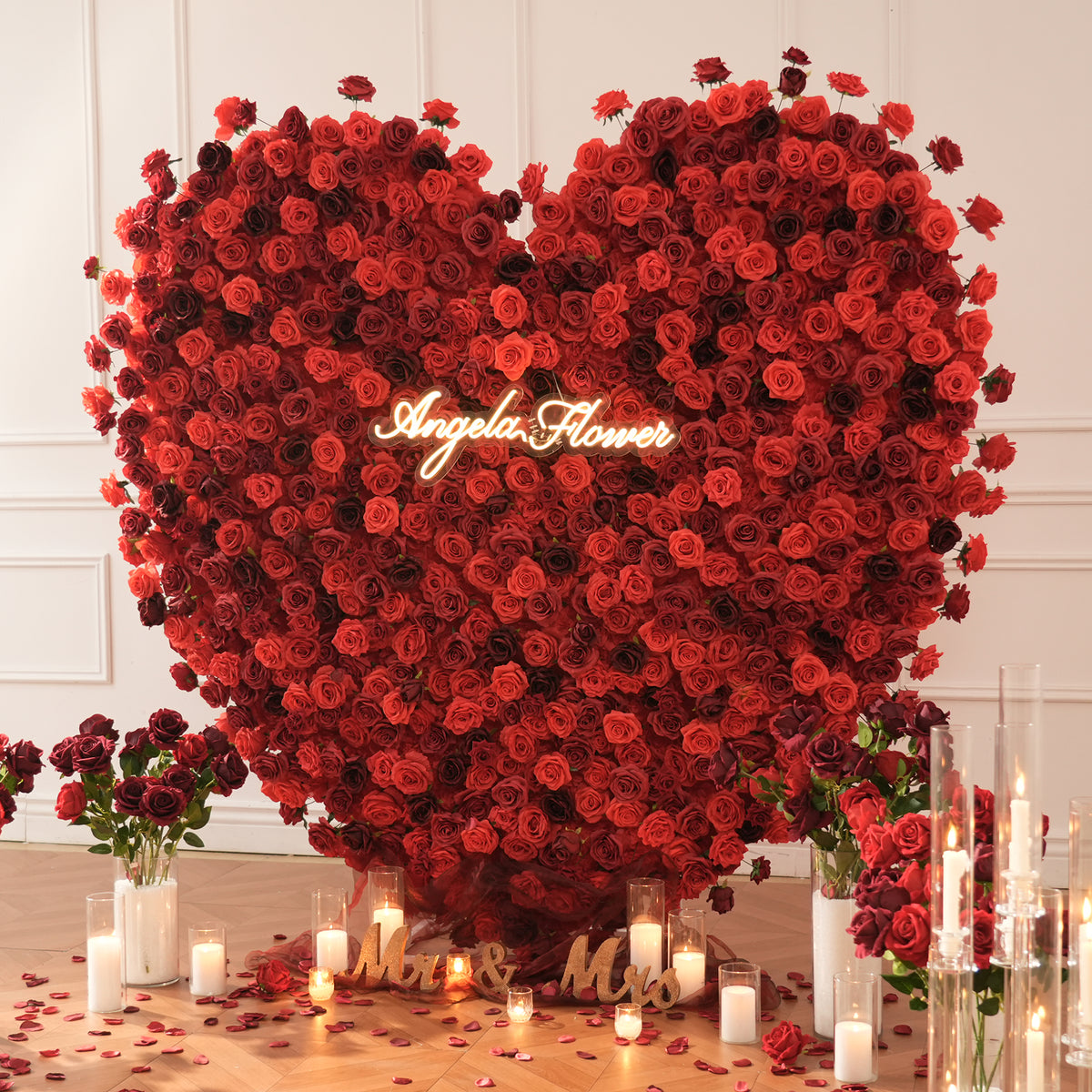 Closeup of layered red rose heart flower wall blooms