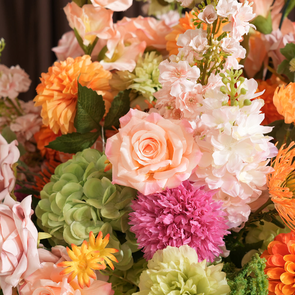 Warm tone silk flower table arrangement for celebration