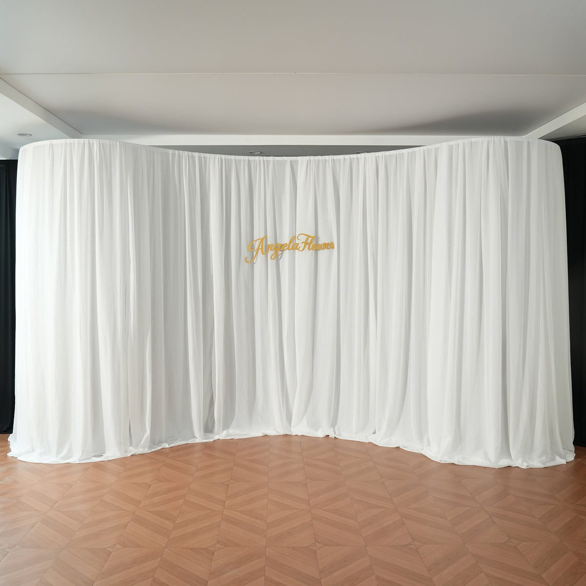 white chiffon curtain on semicircle backdrop stand