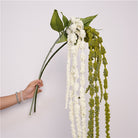 faux drooping amaranthus wedding backdrop decor