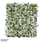 Event photoshoot faux flower wall, dense white silk rose with varied greenery panel for wedding background