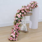 Artificial peony, rose and small flowers from wedding cascading table flower runner