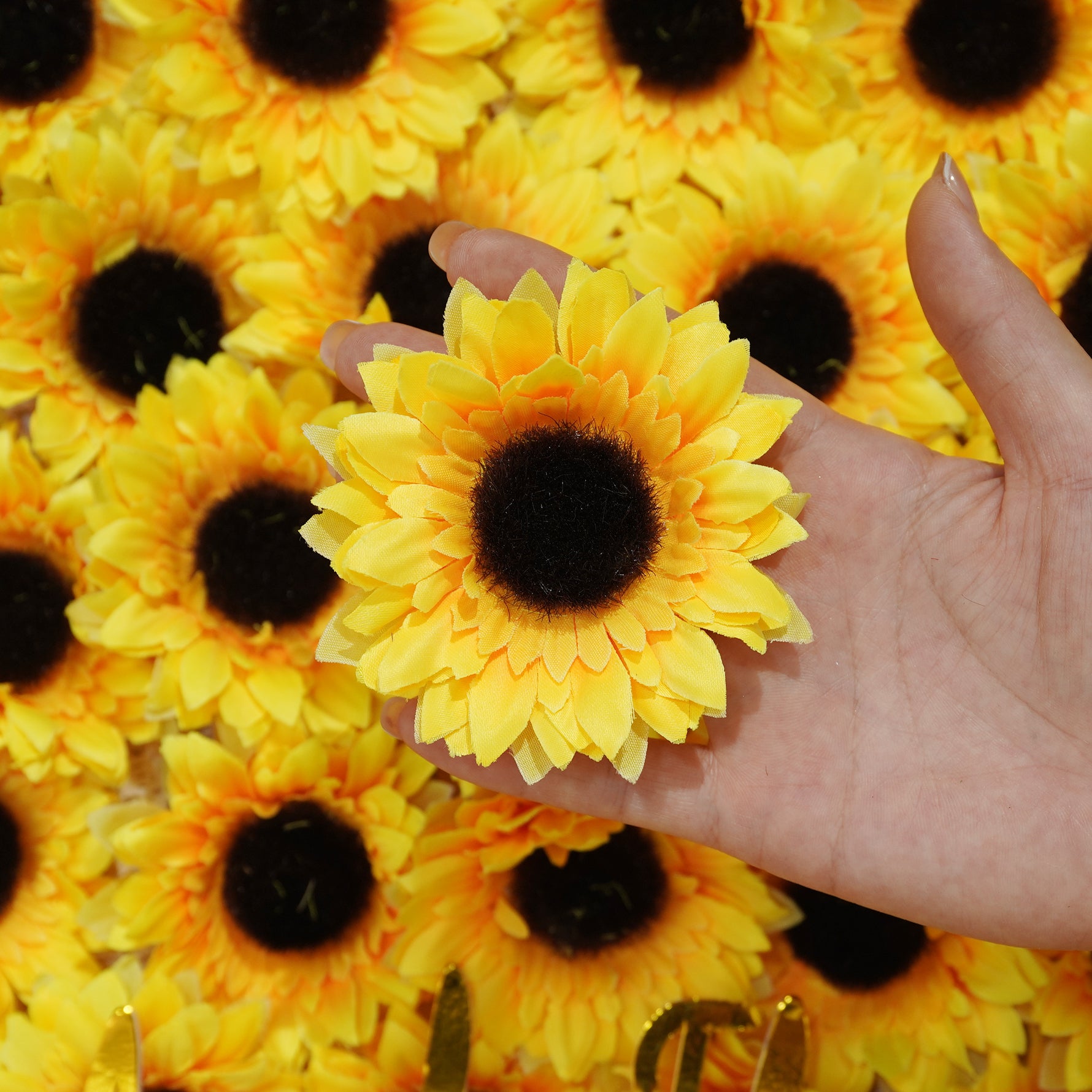 hand_held_faux_sunflower_closeup