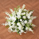 white-flower-green-leaf-centerpiece