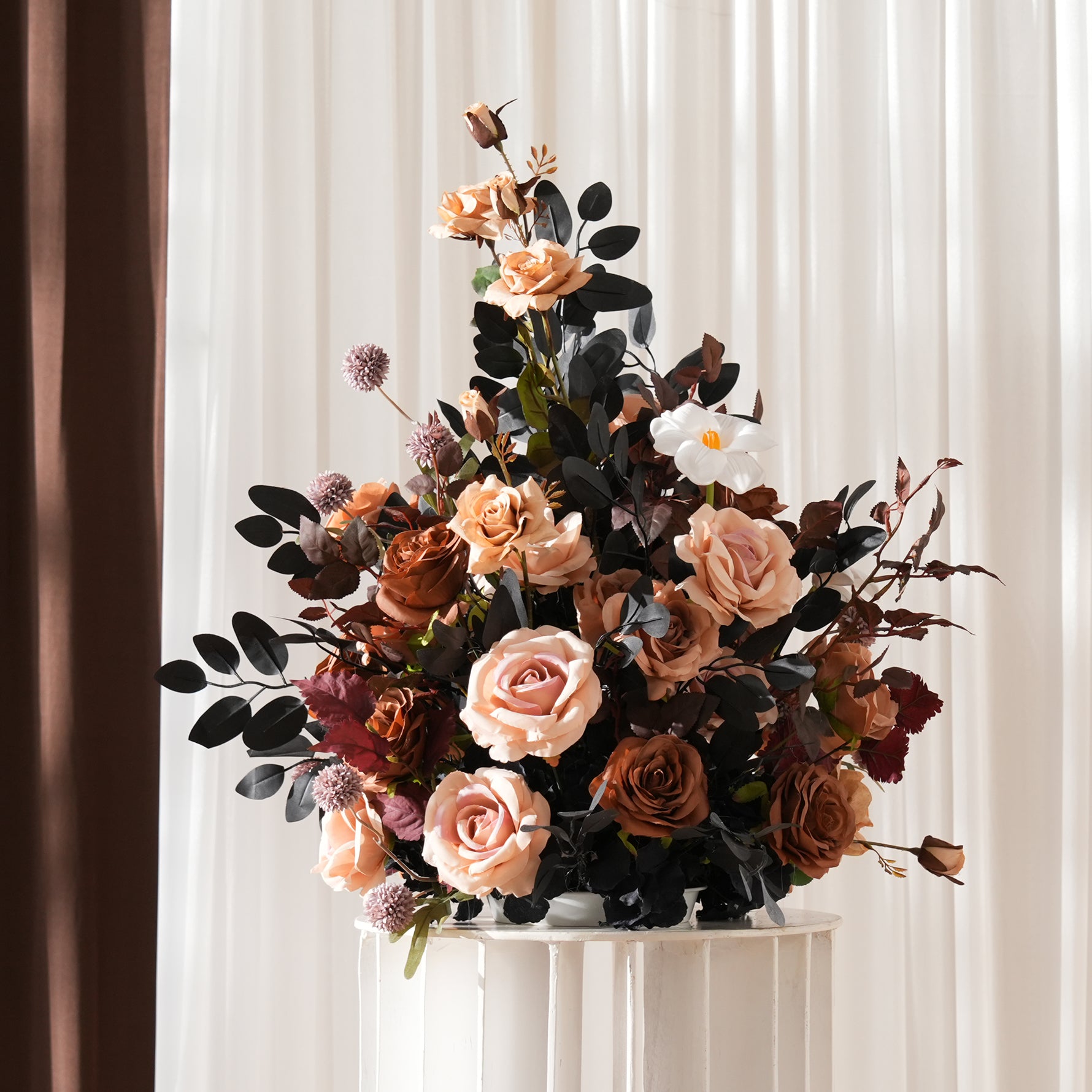 faux rose arrangement with black leaves