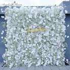  Outdoor installation of white flower wall as photo backdrop for garden wedding events