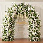 Side view of full white and green artificial wedding arch flowers