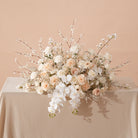 Wedding aisle decorated with champagne flower petals and candles
