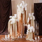 outdoor sunset wedding ceremony floral decor with white orchids and cascading amaranthus