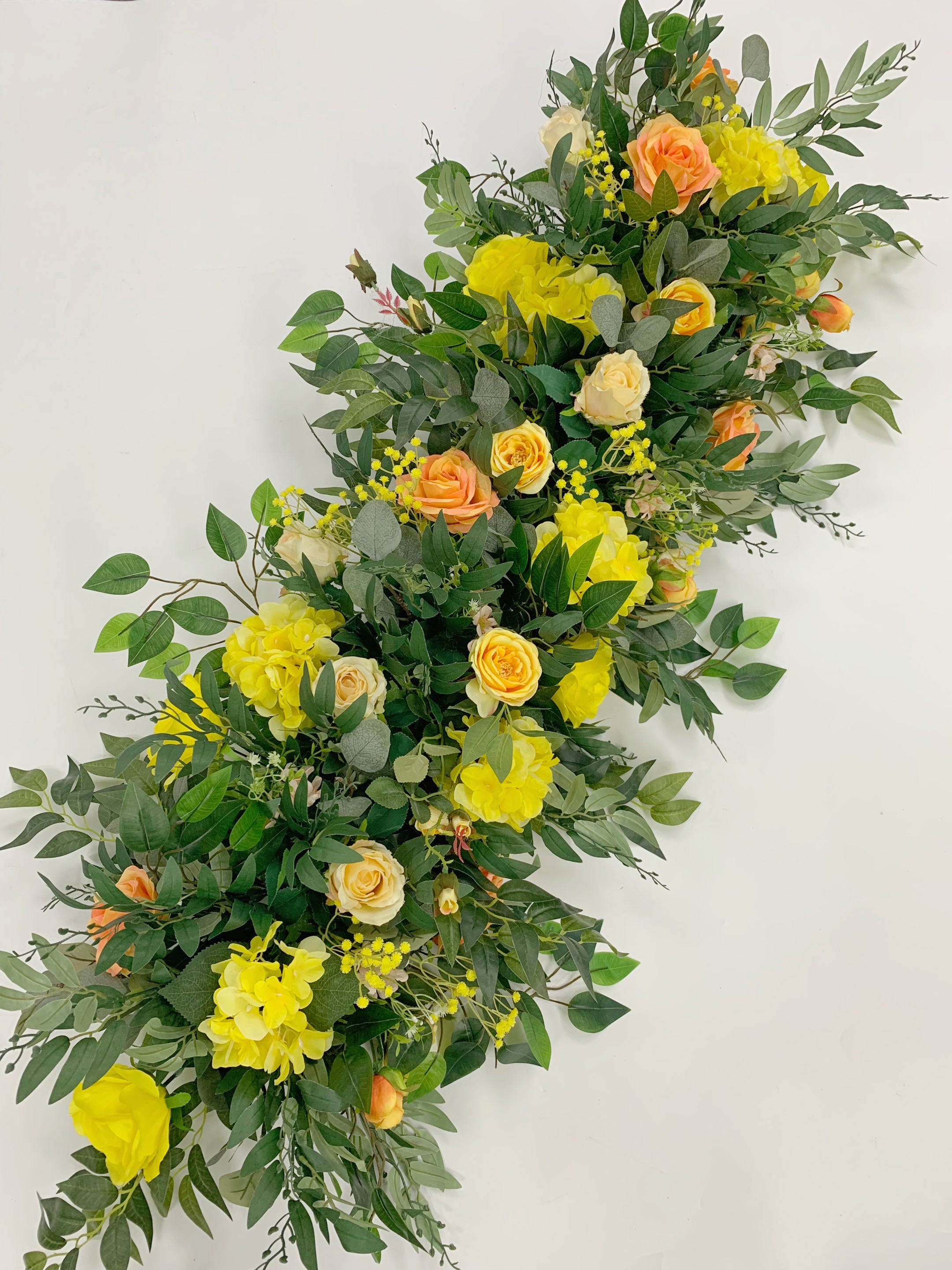 Autumn orange cascading flower swag for harvest wedding
