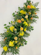 Autumn orange cascading flower swag for harvest wedding