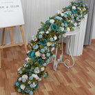 Outdoor garden wedding long faux flower table runner with mixed roses, peonies and fresh green foliage